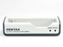 PENTAX CARICABATTERIA/STAND D-BC23 NUOVO